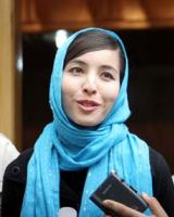 رکسانا صابری به همراه پدرش در تهران / عکس: xinhua